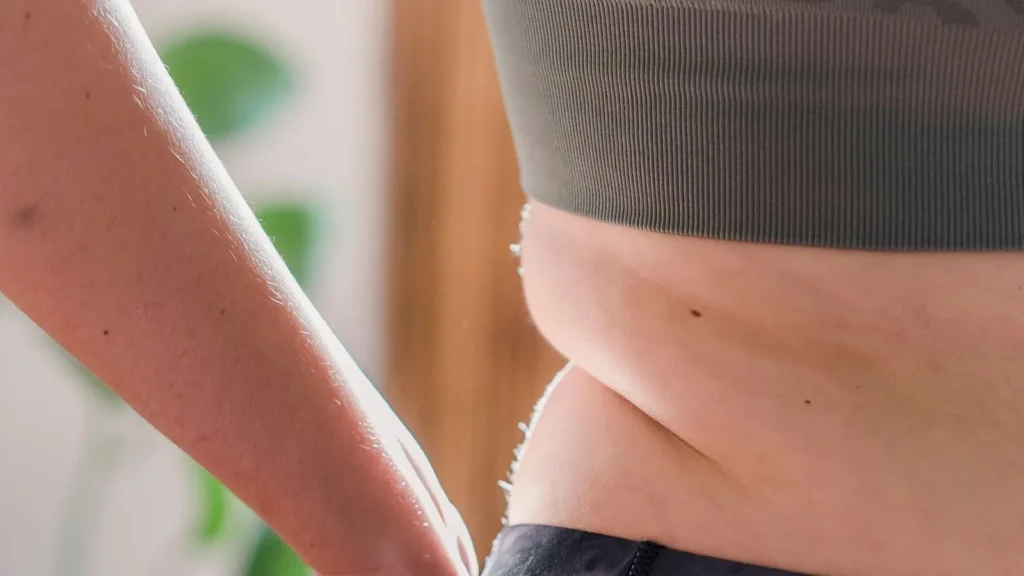 Woman checking her waist